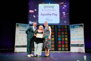 Ayesha Fay is presented her winners certificate by Patrick Monahan