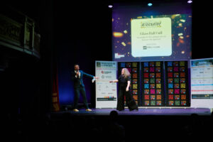 Sarah Higgins presents the award on stage with Patrick Monahan
