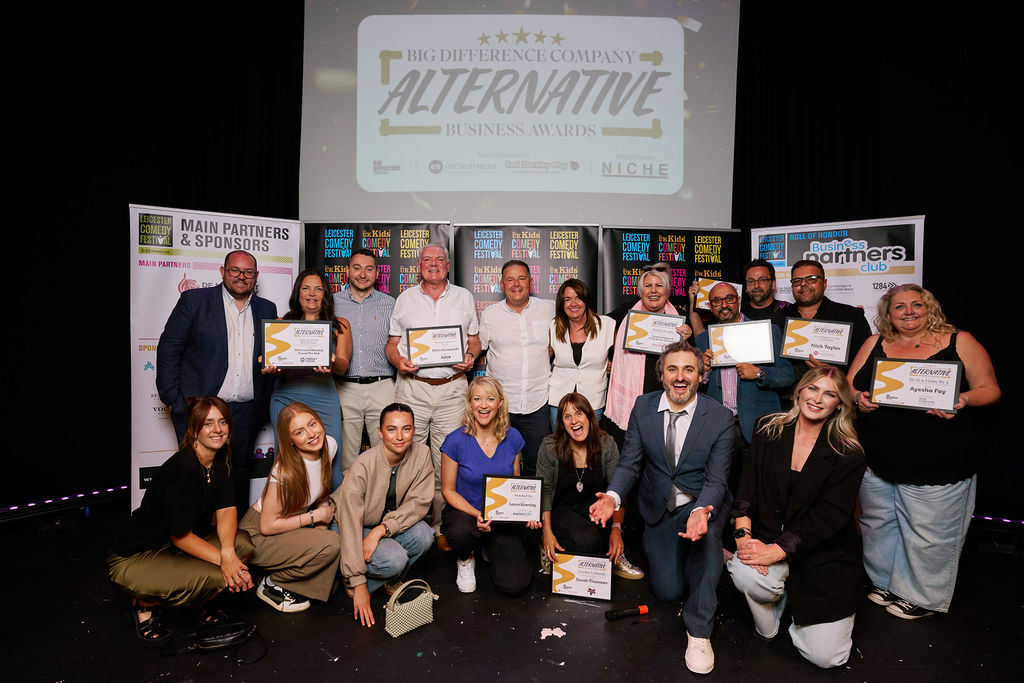 All category winners from The Alternative Business Awards 2025 stand on stage for a group photo.